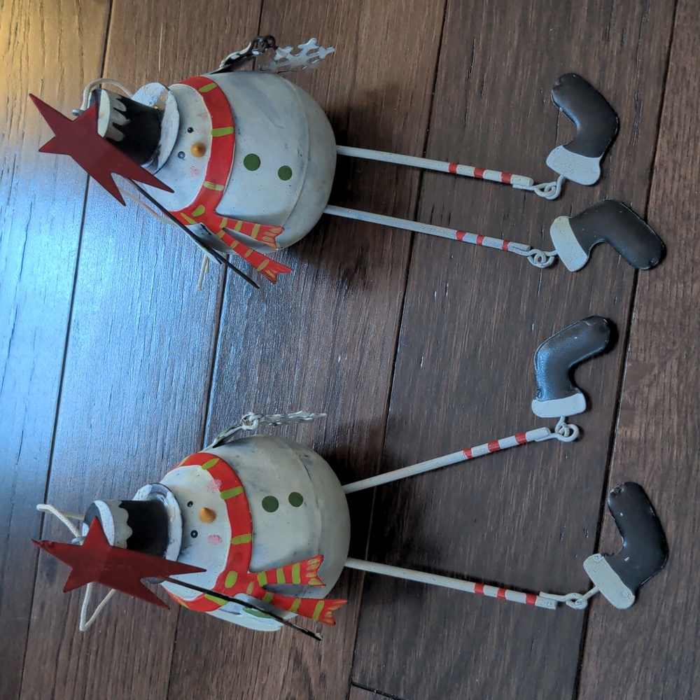 Like new pair of metal snowman ornaments